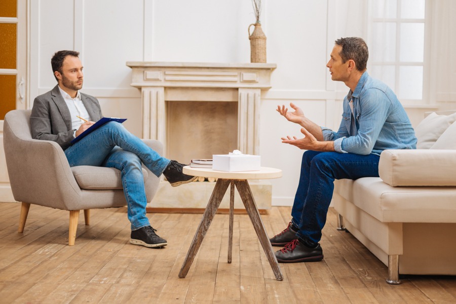 a patient and therapist talking during outpatient rehab